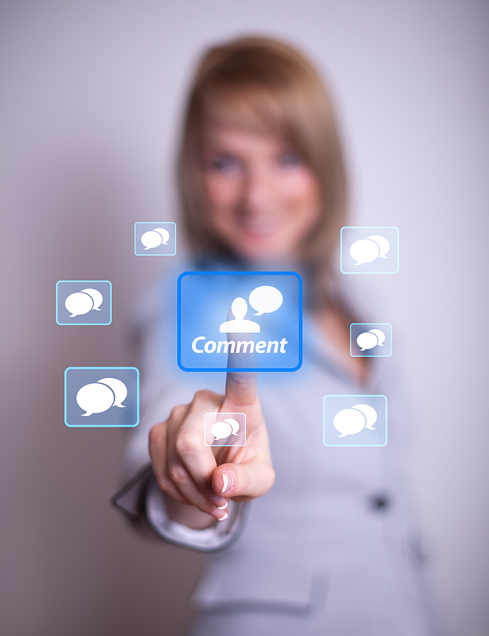 woman hand pressing COMMENT button, backround in bokeh woman hand pressing COMMENT button, backround in bokeh